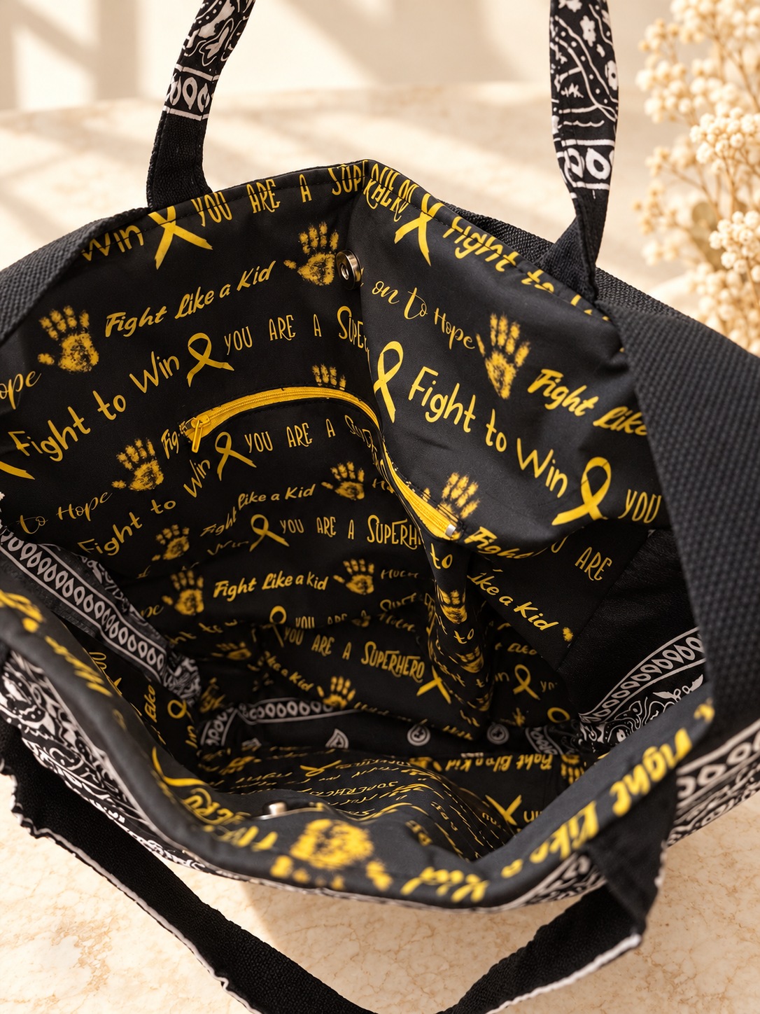 Special-order black and yellow awareness lining with interior zipper pocket and magnetic snap closure